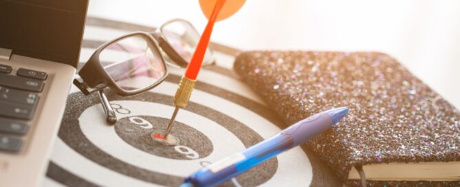 Team analyzing digital marketing strategy on laptop and charts – PCW Agency 2025.